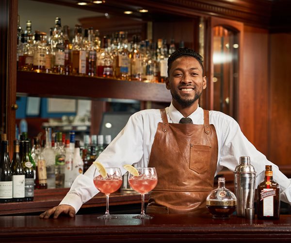 Barman Serving Cocktails At The Loch View Bar