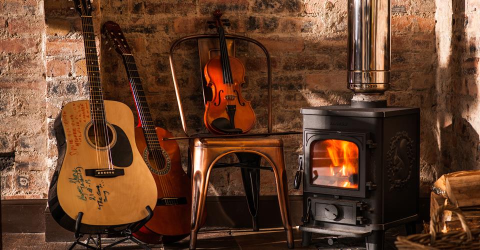Musical Instruments & Fireplace at The Glencoe Inn