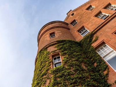 Fonab Castle | Wooden Castle Doors Surrounded by Brick With Ivy at Fonab Castle Hotel in Pitlochry ?? Fonab Castle