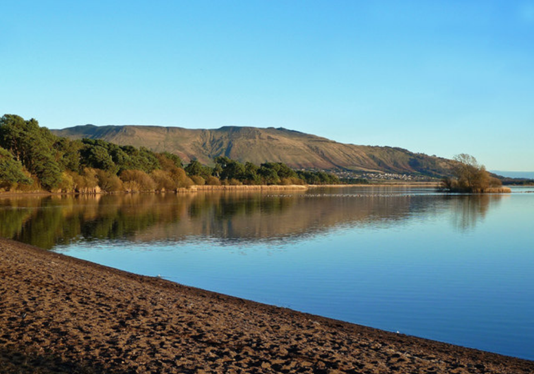 National Nature Reserve, Loch Leven, viewed at Burleigh Sands overlooking Kinnesswood and Munduff Hill.