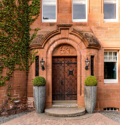 Wooden Castle Doors Surrounded by Brick With Ivy at Fonab Castle Hotel in Pitlochry ?? ''